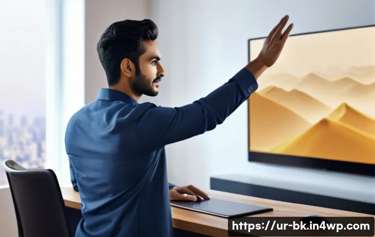 제스처 기반 인터페이스의 실제 사용자 경험 연구 - A modern office environment with a young South Asian man using gesture-based controls on a large sma...